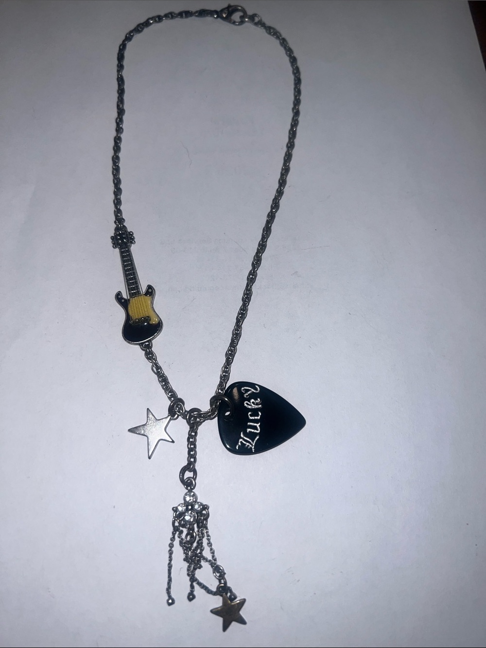 Lucky brand vintage Y2K necklace with guitar pick and guitar, silver and black